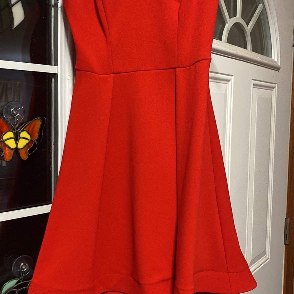 Red dress. Size 5/6, crosses in back. Worn once for Valentine’s dance.